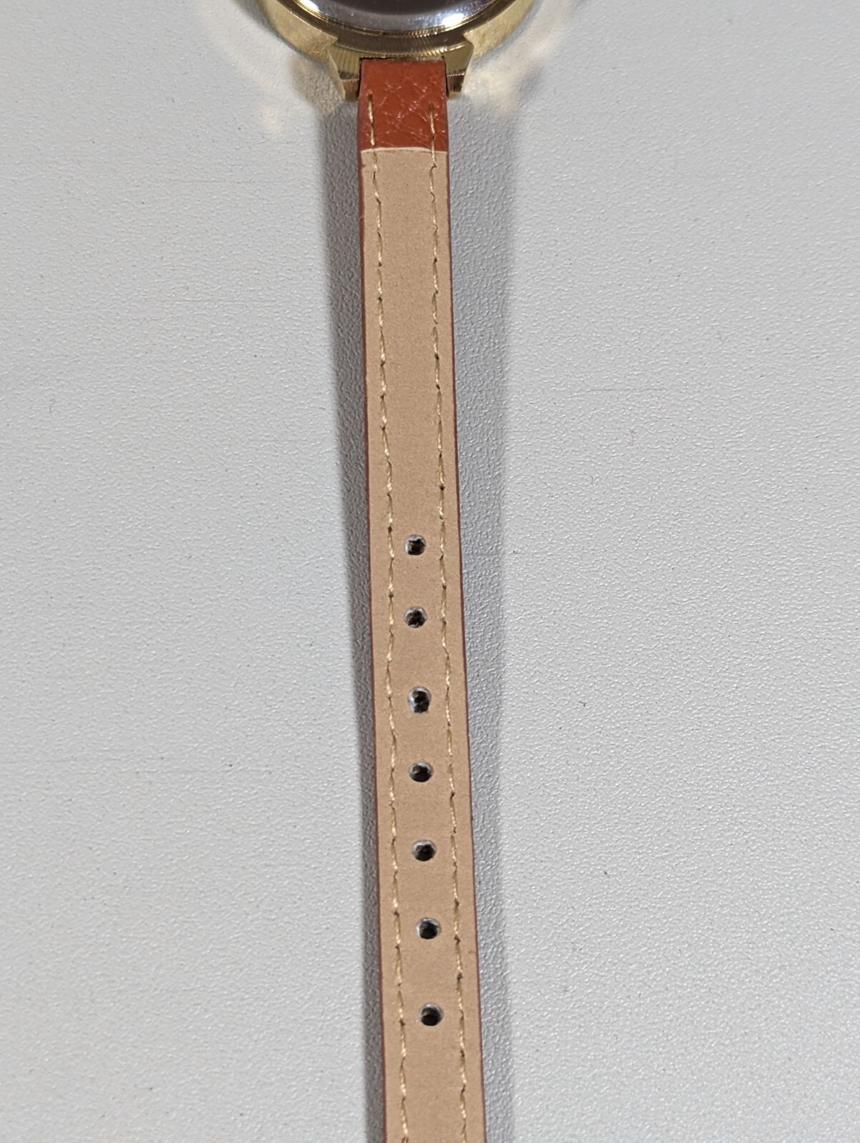 Womans Francesca’s Gold Tone Dial Crystal Accent Round Case Brown Band Watch
