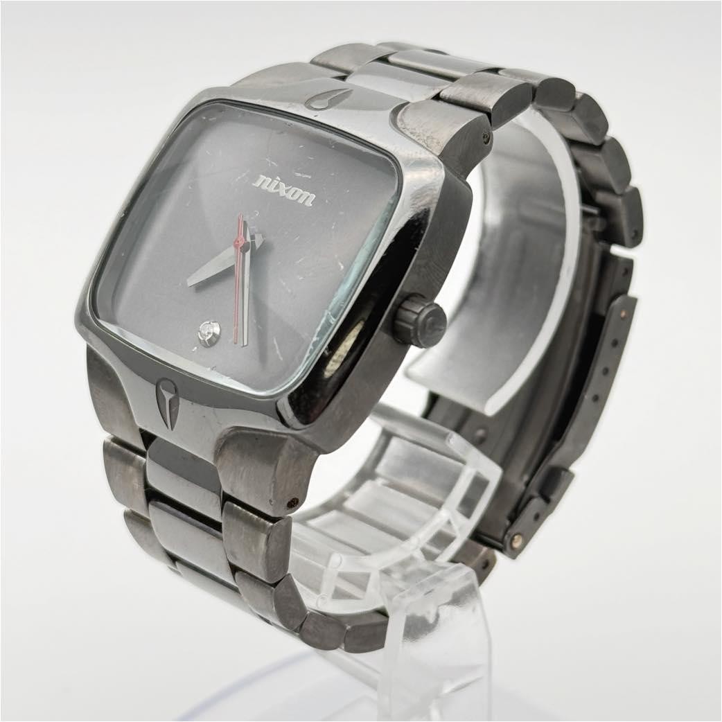 Nixon The Player Quartz Stainless Steel Square Case Silver Dial Men In hand