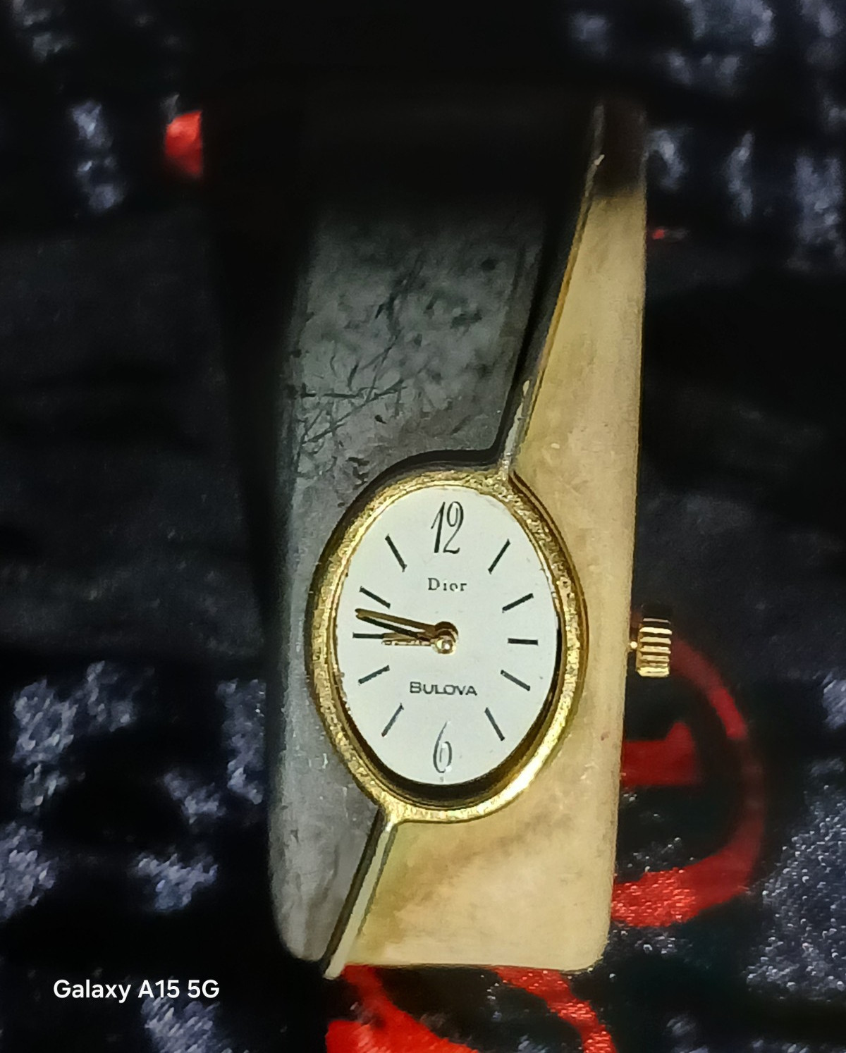 Bulova Dior Women’s Quartz Analog White Dial Gold-Tone Oval Bangle Watch