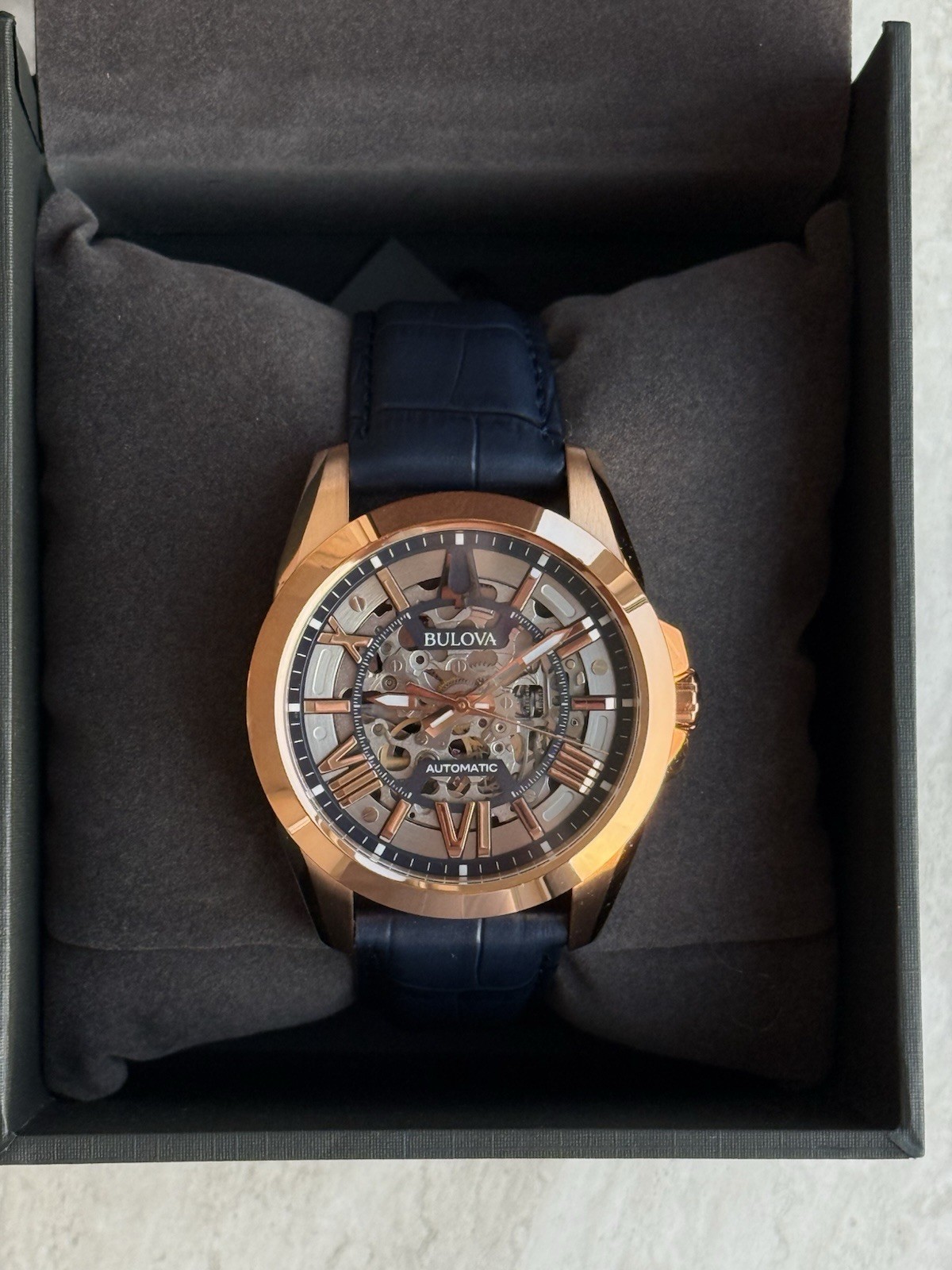 Bulova Sutton Men’s 43mm Automatic Skeleton Dial Rose Gold/Blue Leather w/ Box