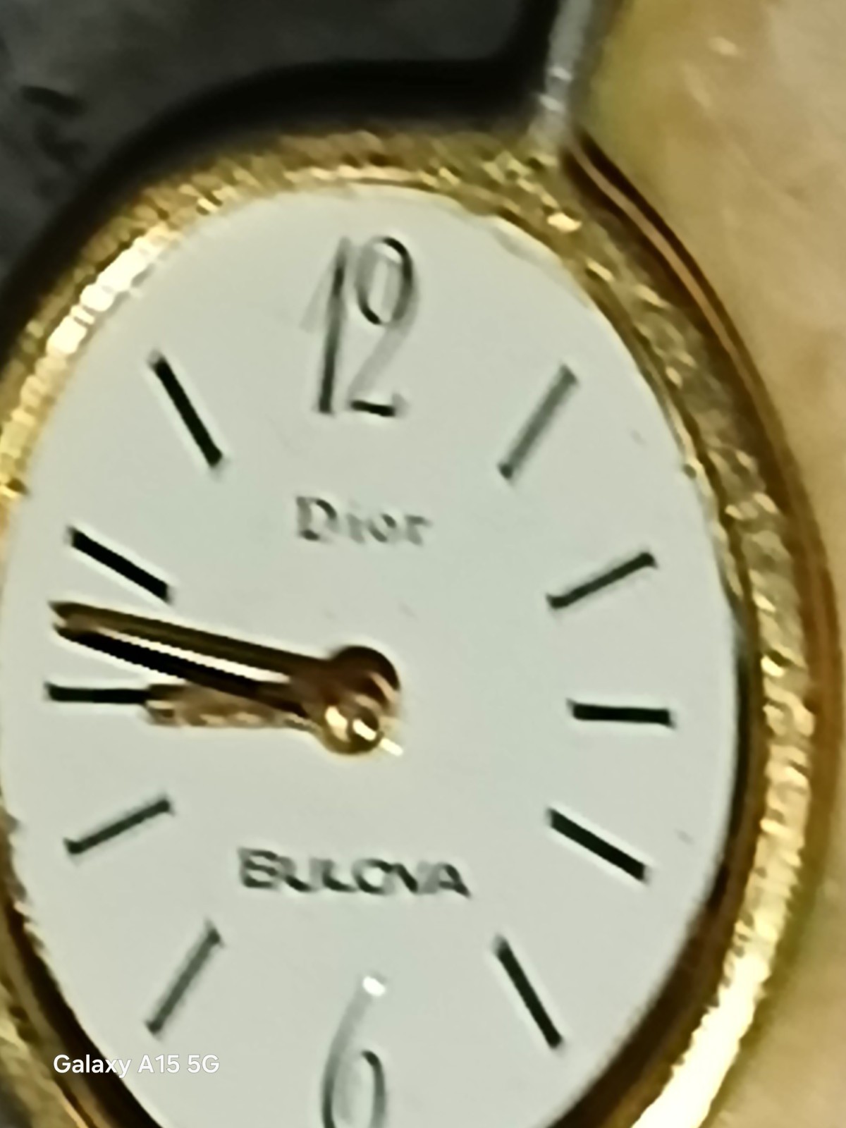 Bulova Dior Women’s Quartz Analog White Dial Gold-Tone Oval Bangle Watch