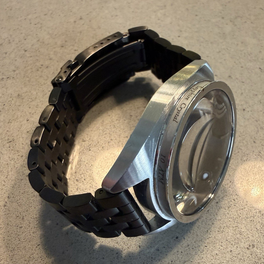 Nixon The Supremacy Swiss Made Automatic Gray Dial Sapphire crystal.NEEDS REPAIR
