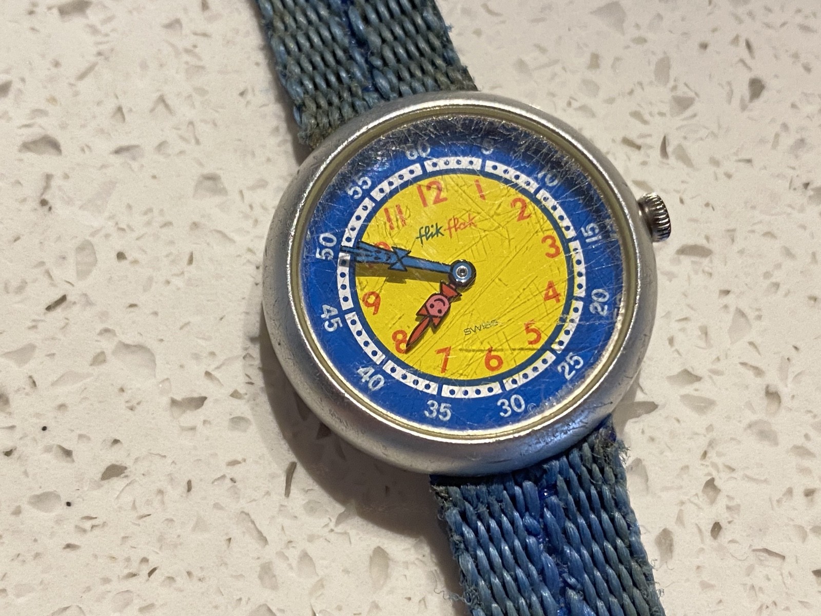 Flik Flak blue kids watch with visible scratches, 80s or 90s. May or may not run