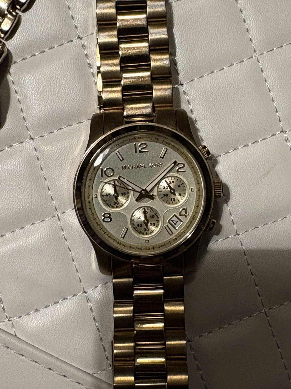 Michael Kors Women’s Quartz Gold-Tone Silver Dial Chronograph Date Bracelet