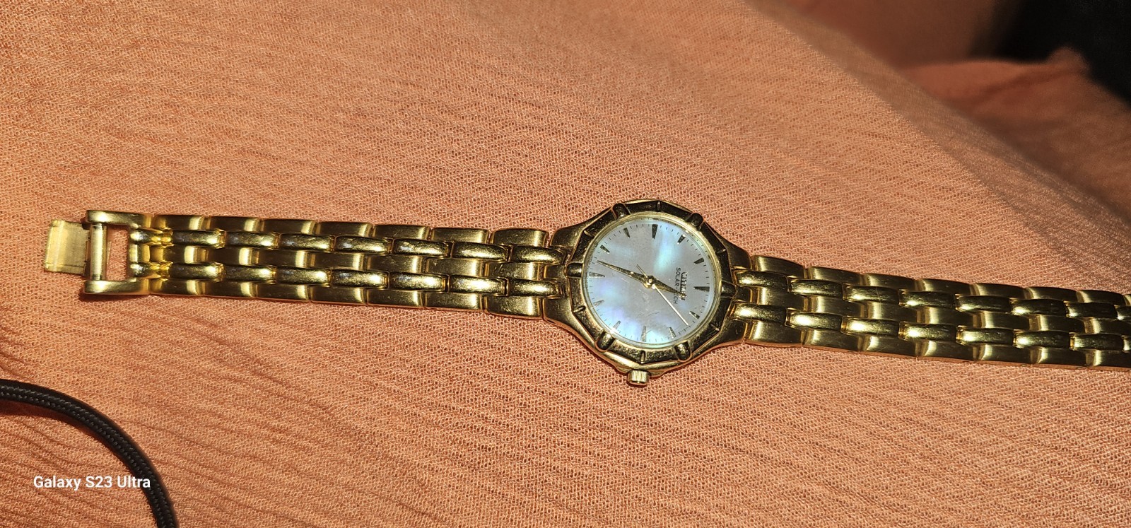 Citizen Solar-Tech women’s watch gold-tone link bracelet mother-of-pearl dial.