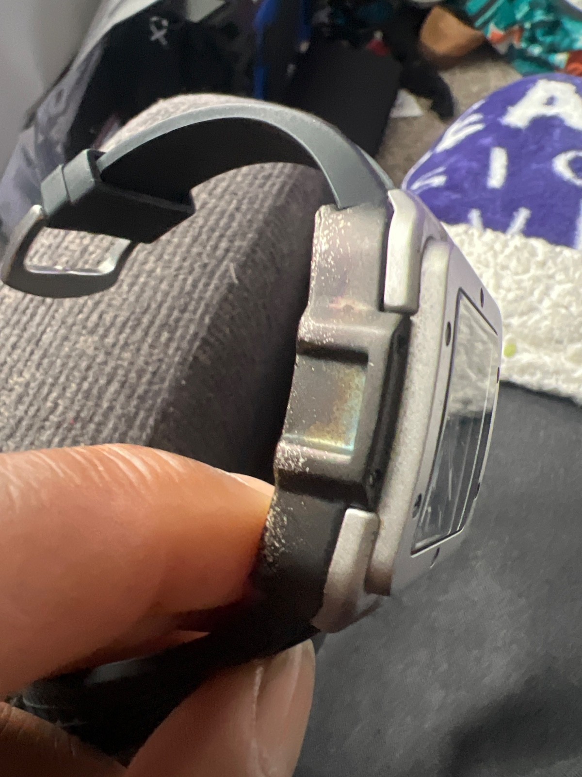 Doesn’t keep accurate time Black strap , square bezel grey face black dial .