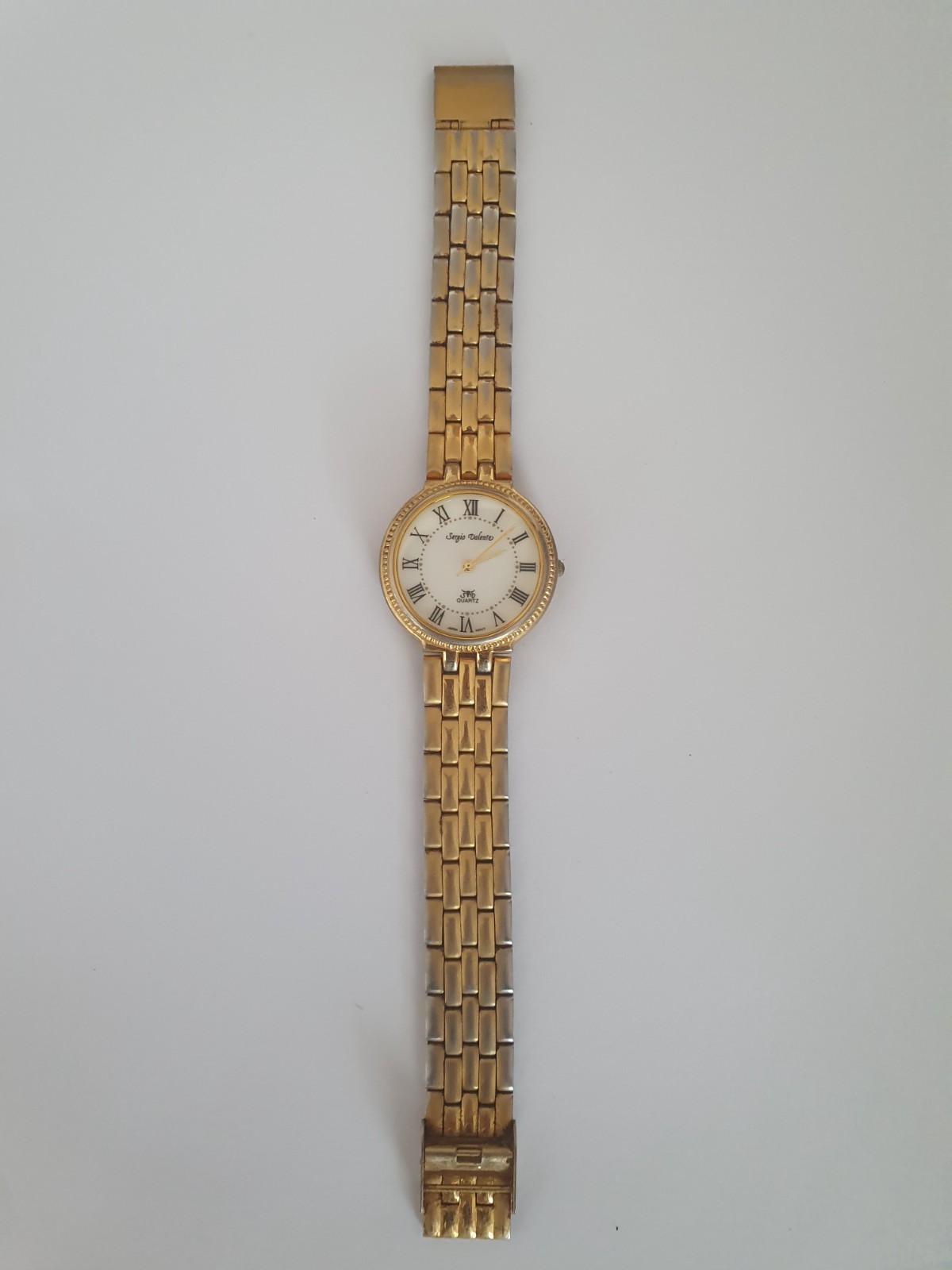 watches for men, vintage Sergio Valente watch features a gold-plated case