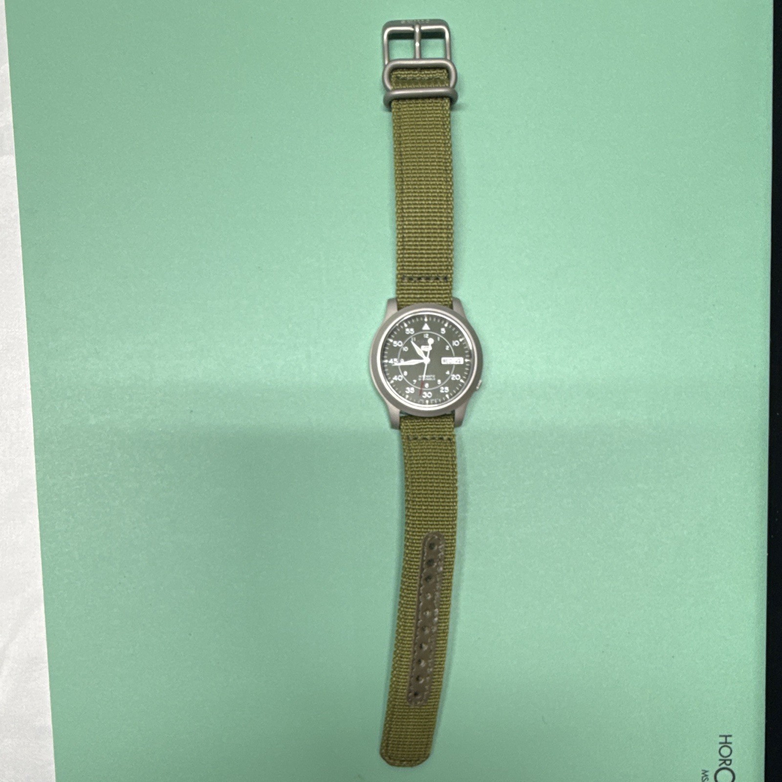 Seiko 5 Men’s Automatic Military Dial Day/Date Green Nylon Strap Watch 7s26-02j0