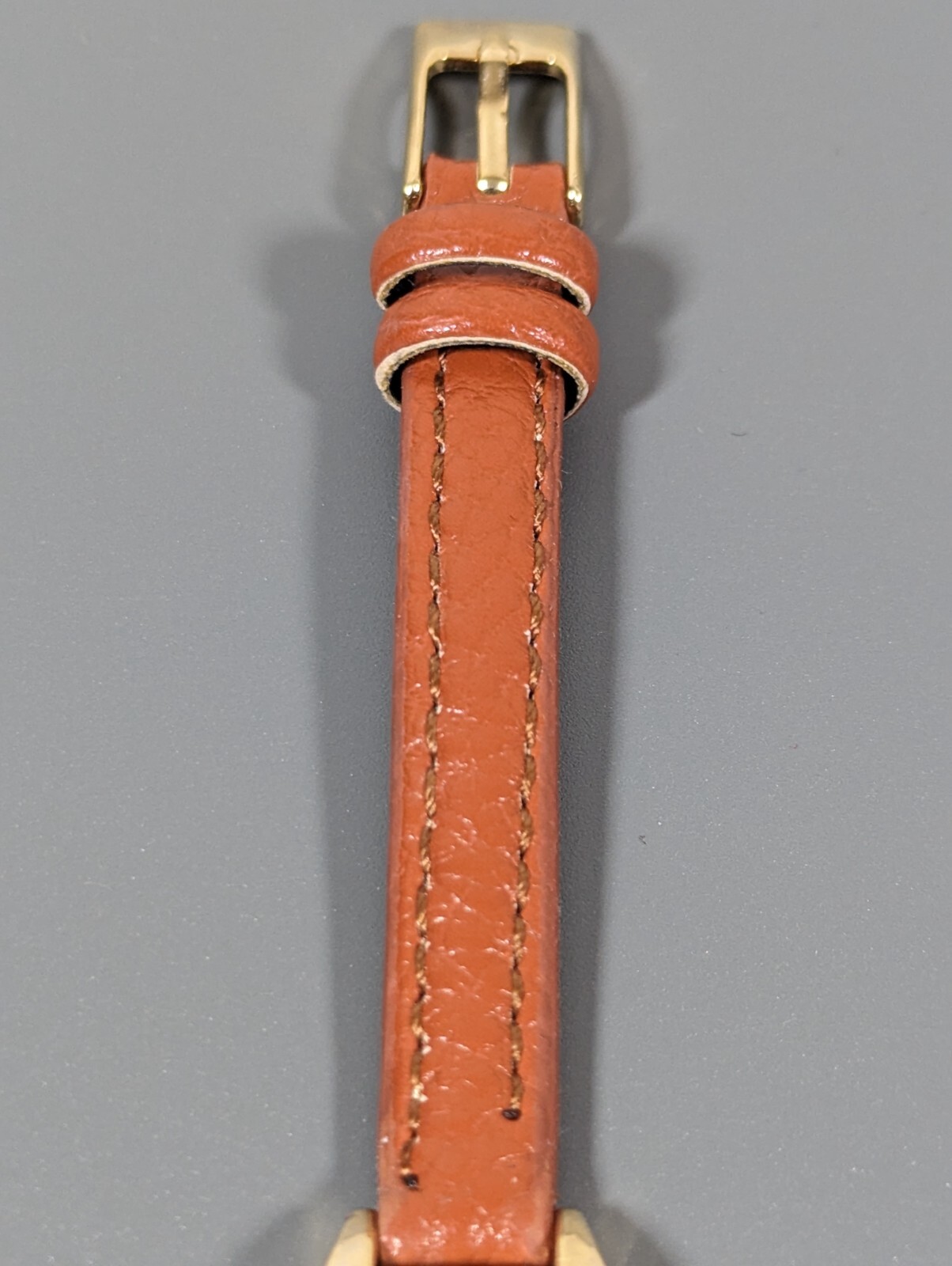 Womans Francesca’s Gold Tone Dial Crystal Accent Round Case Brown Band Watch