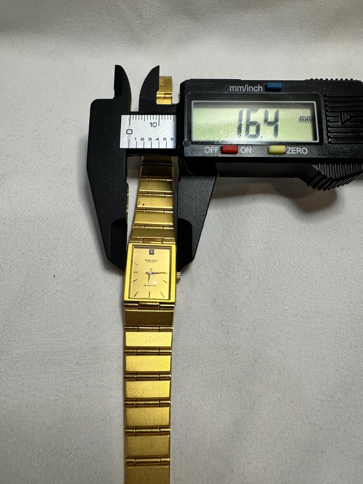 VINTAGE GOLD TONE GRUEN PRECISION QUARTZ TANK STYLE WATCH