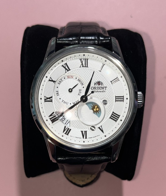 Orient RA-AK0008S10B Sun & Moon, Day/Date, Automatic White Silver Dial Watch