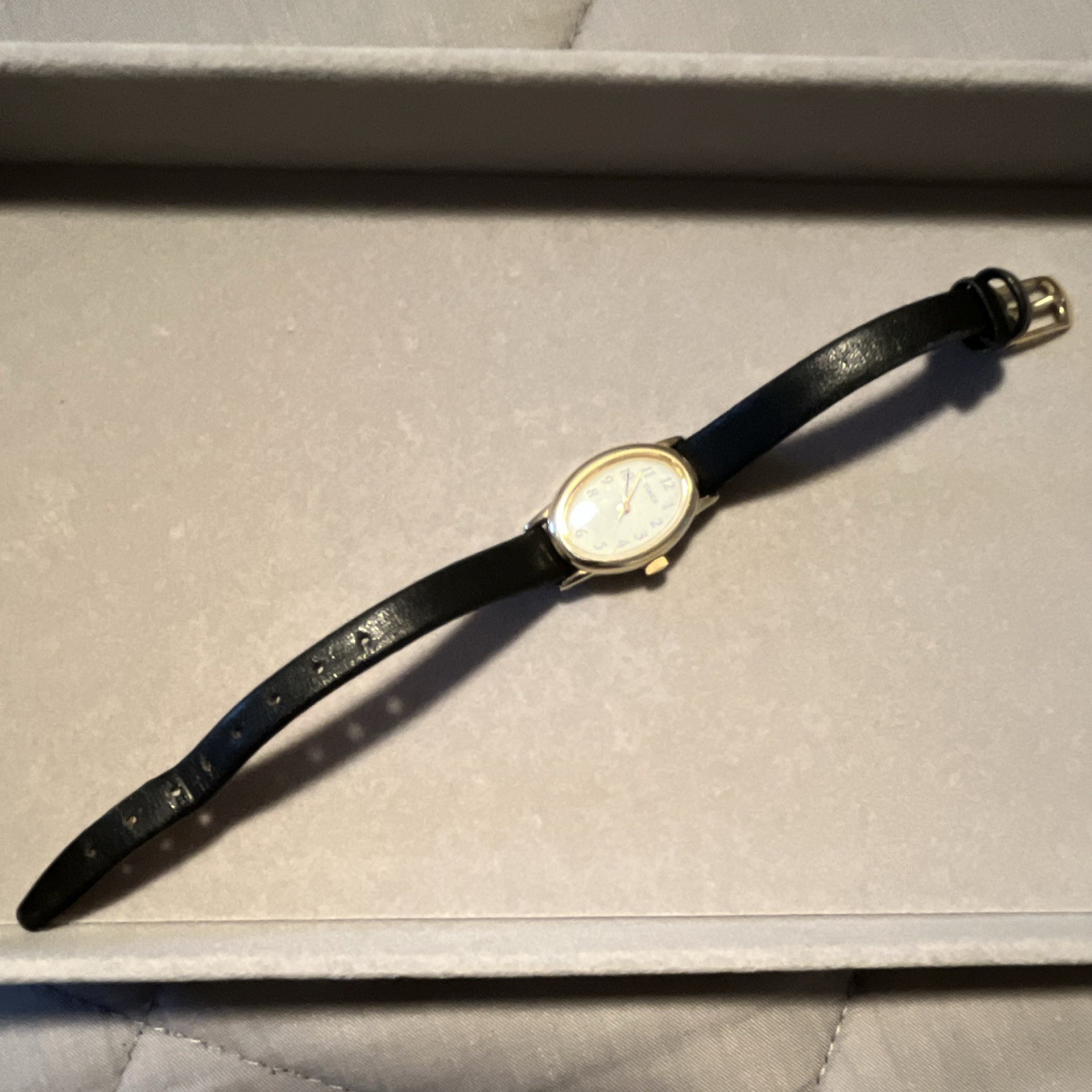 Timex Women’s Vintage Quartz Oval Gold-Tone Watch White Dial Black Leather