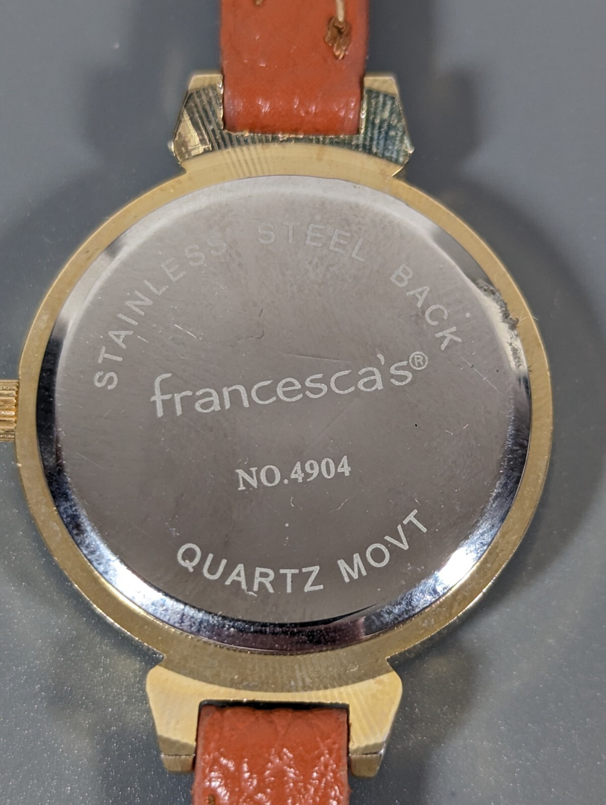 Womans Francesca’s Gold Tone Dial Crystal Accent Round Case Brown Band Watch