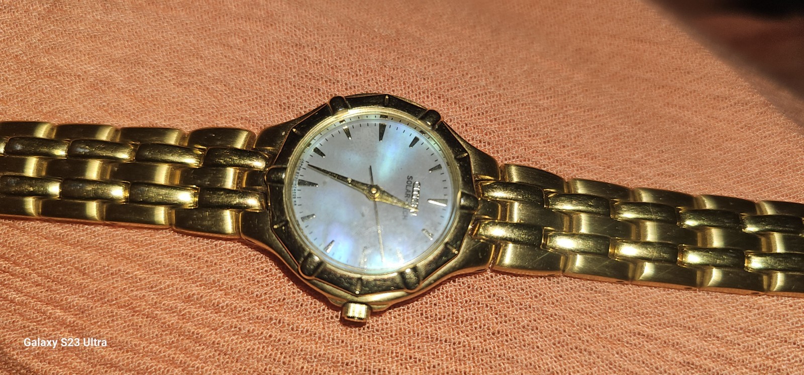 Citizen Solar-Tech women’s watch gold-tone link bracelet mother-of-pearl dial.