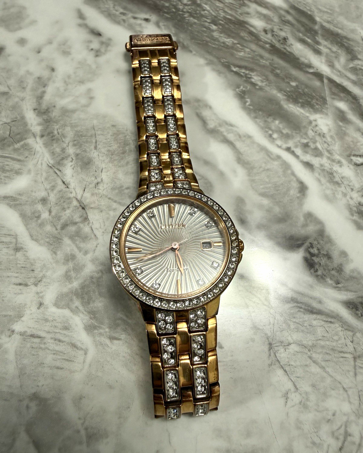 Citizen Eco-Drive Women’s Gold Bracelet Watch Gem-Set Bezel Date Silver Dial