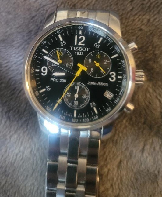 mens Tissot watch, brand new condition, includes extra links.