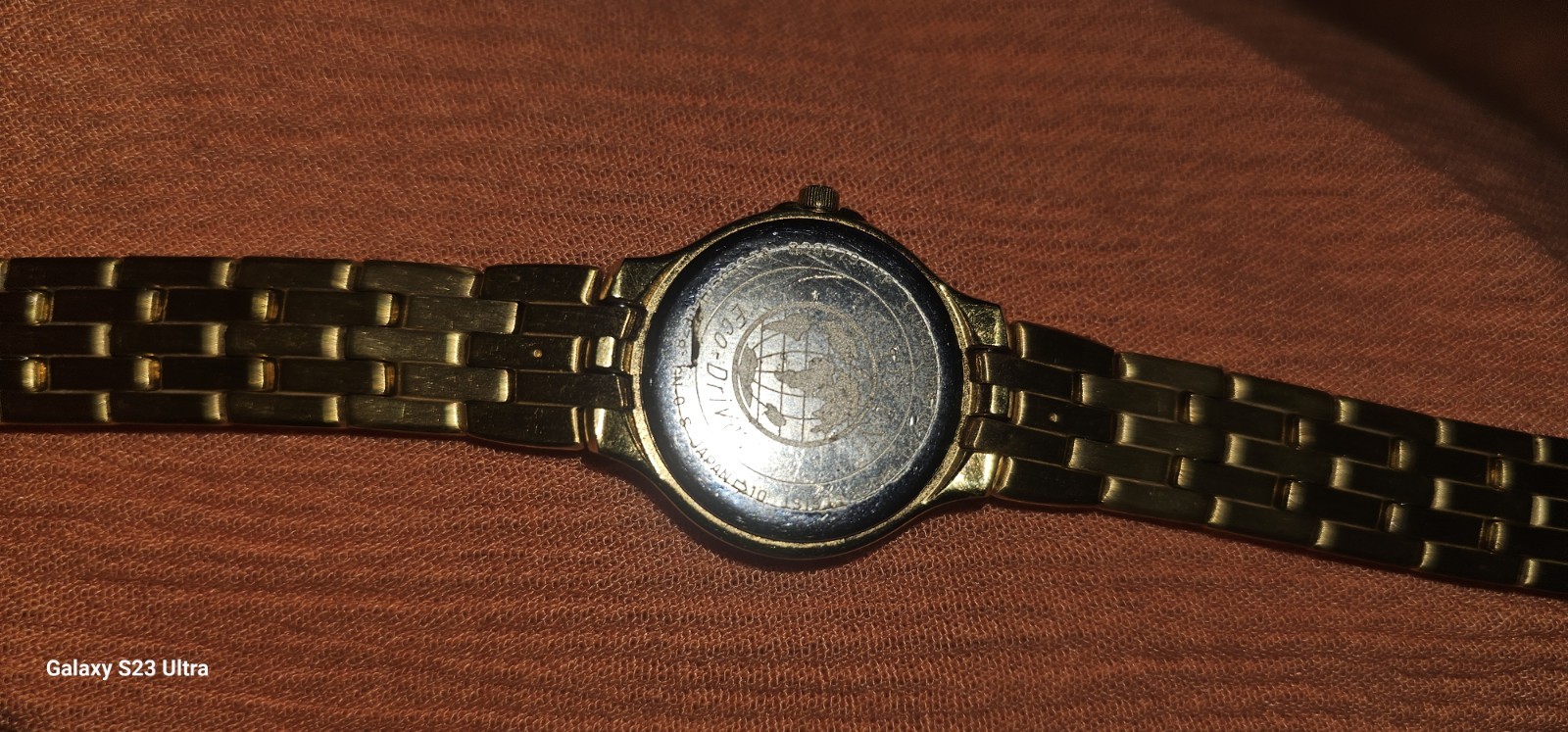 Citizen Solar-Tech women’s watch gold-tone link bracelet mother-of-pearl dial.