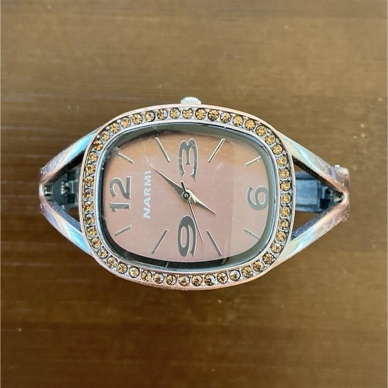 Narmi Gemmed Oval Analog Wristwatch Silver Metal Band Bronze Dial Dress Formal