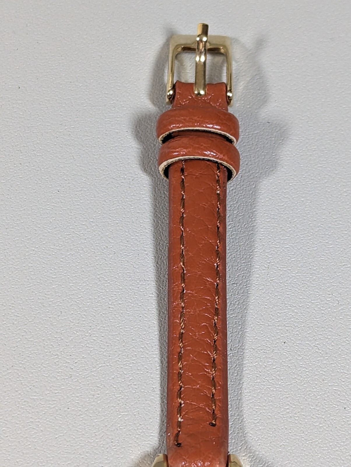 Womans Francesca’s Gold Tone Dial Crystal Accent Round Case Brown Band Watch
