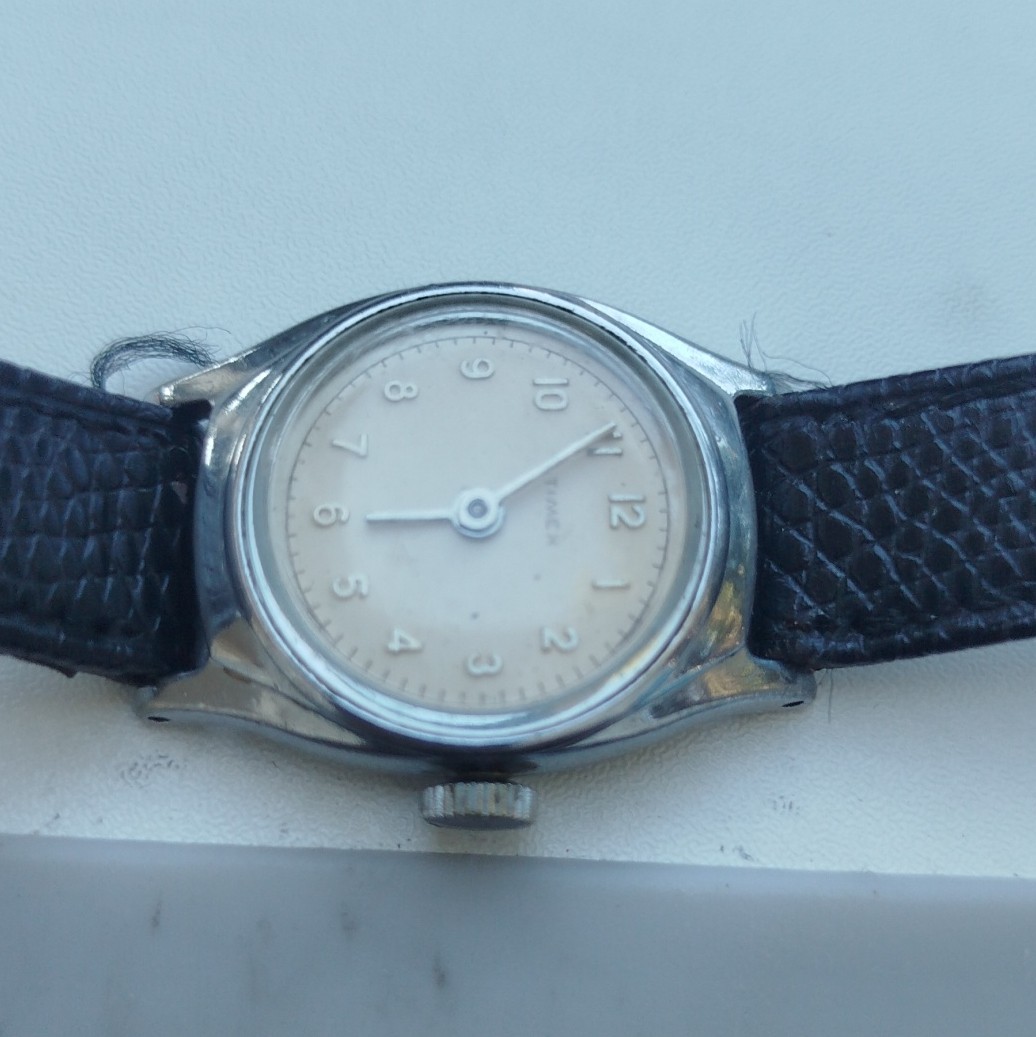 Timex Analog Round Beige Dial Arabic Numerals Silver Case Black Leather Strap