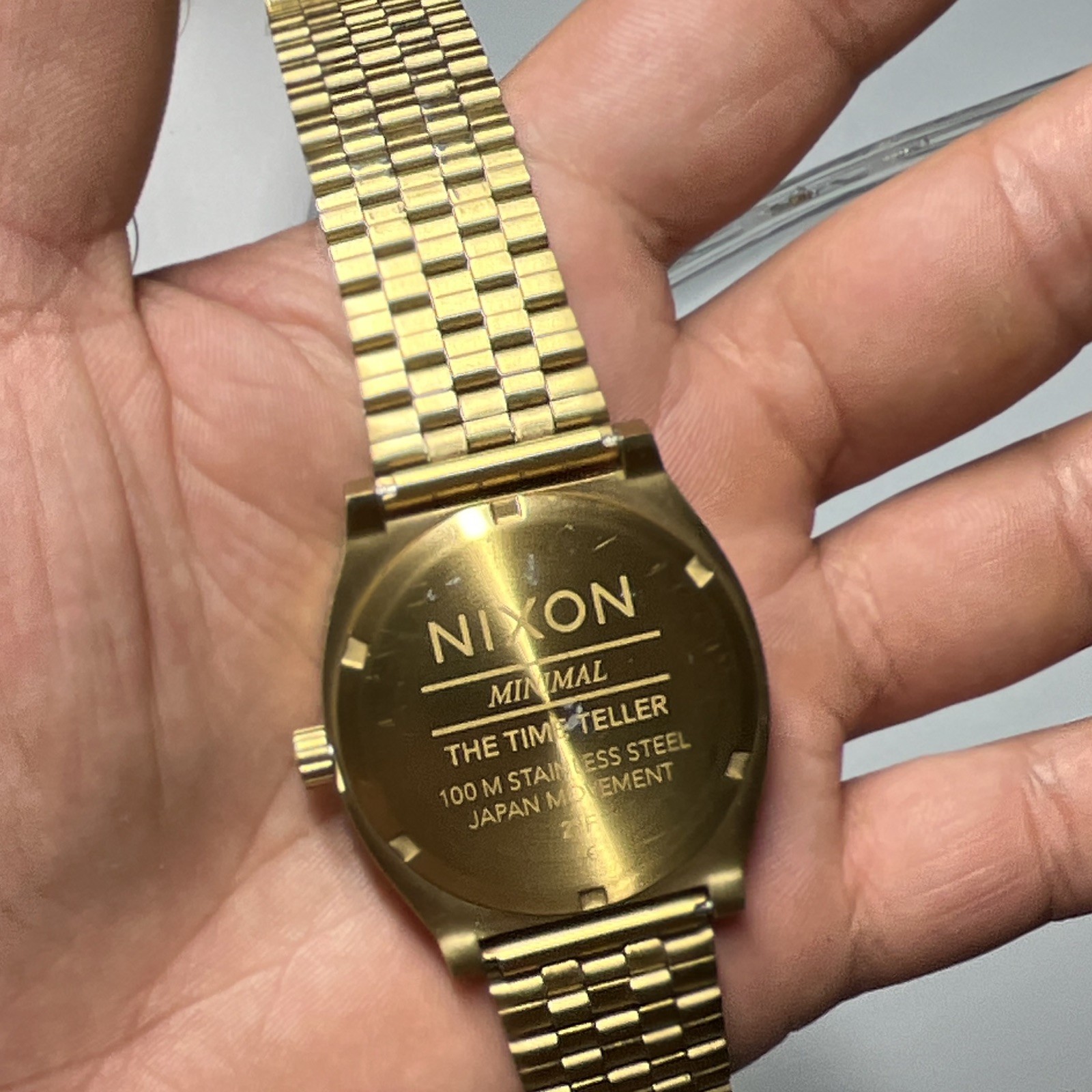 Nixon Quartz Analog Watch Red Dial Gold-Tone Metal Bracelet Seconds Hand