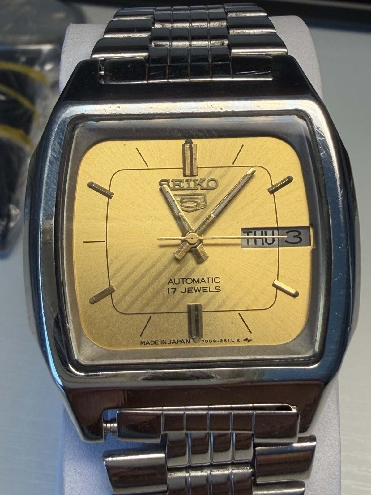 Seiko 5 Men’s Automatic 17J Day/Date Gold Dial Steel Bracelet Square Watch