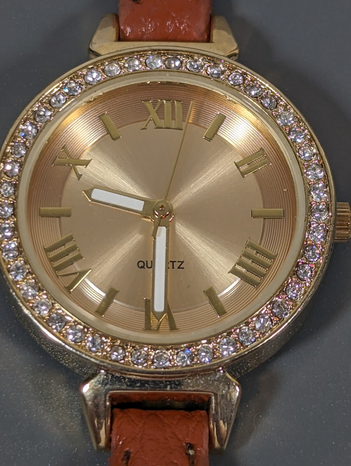 Womans Francesca’s Gold Tone Dial Crystal Accent Round Case Brown Band Watch