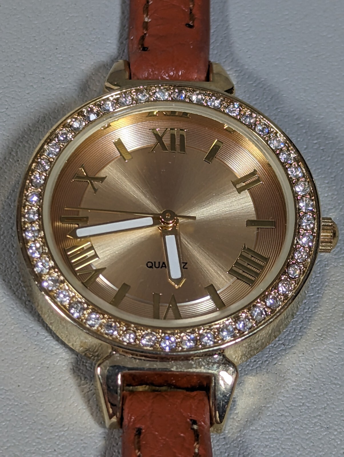 Womans Francesca’s Gold Tone Dial Crystal Accent Round Case Brown Band Watch