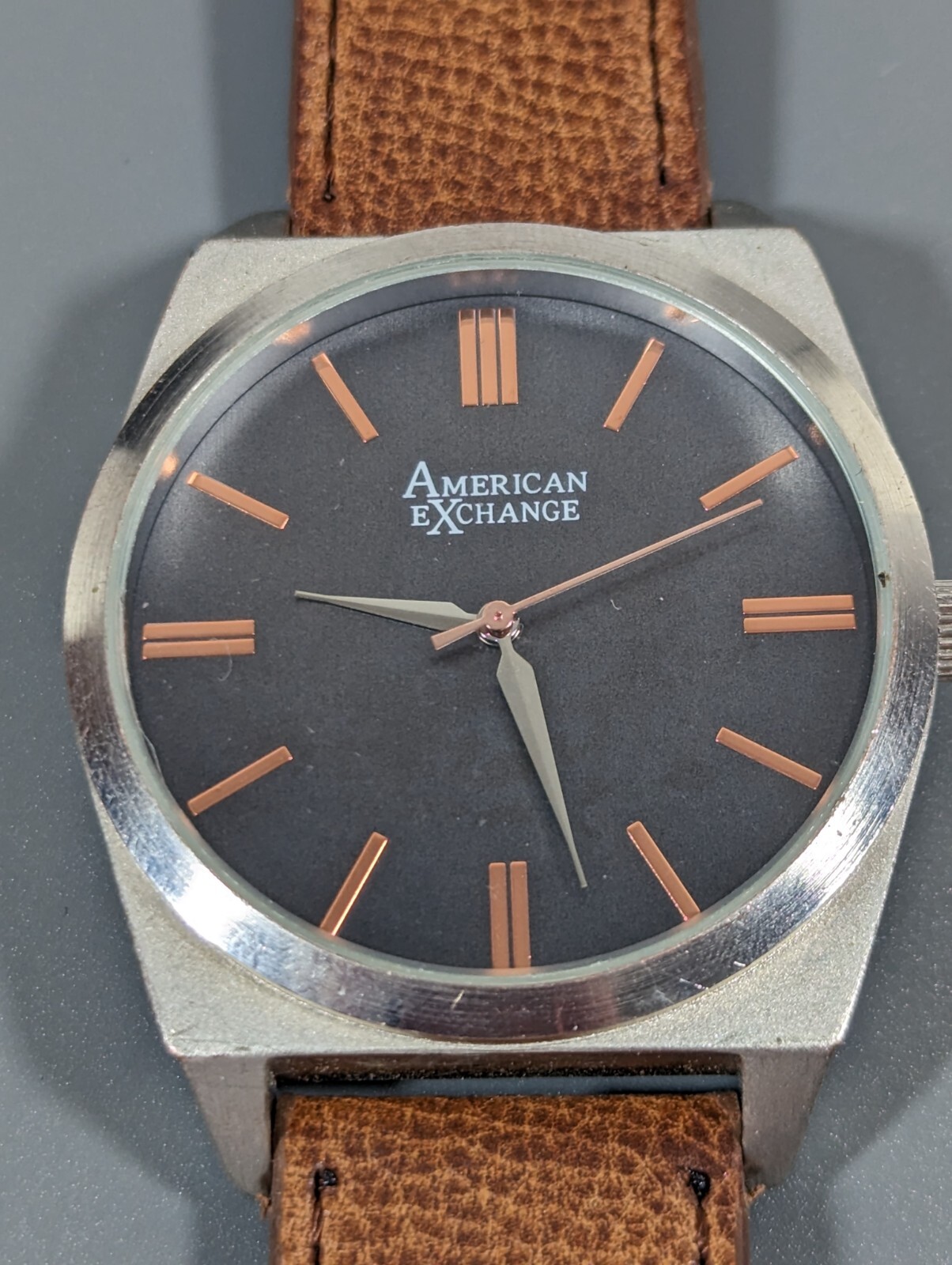 American Exchange Black Dial Round Silver Tone Case Brown Faux Leather Bnd Watch