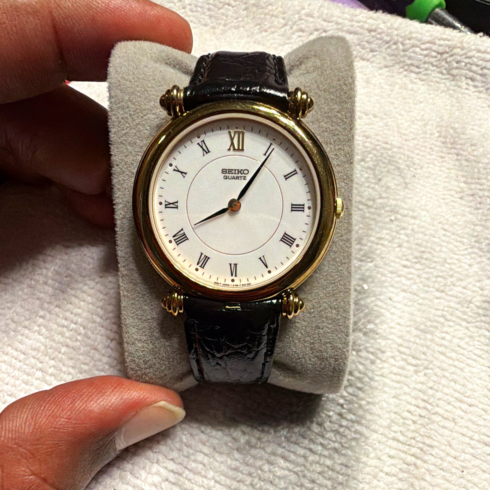Seiko Quartz Dress Watch Gold Tone Round Roman Numerals White Dial Black Leather