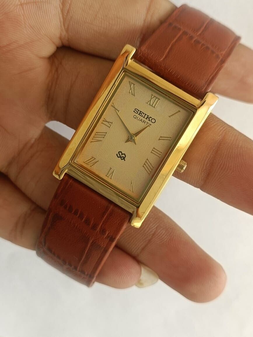 Vintage Seiko Slim Quartz Gold Face Rectangle Japanese 26MM Case Mens Watch A07